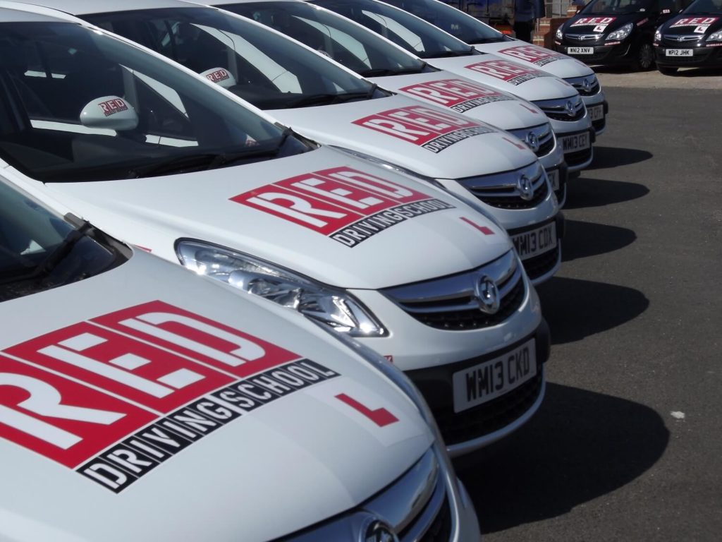 RED driving school white cars